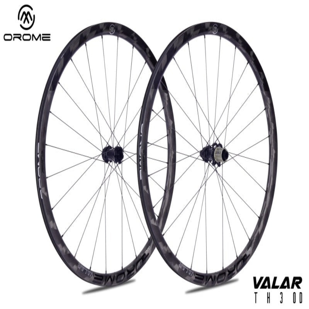 Two bicycle wheels with 'Orome' branding on a white background