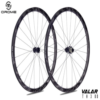 Two bicycle wheels with 'Orome' branding on a white background