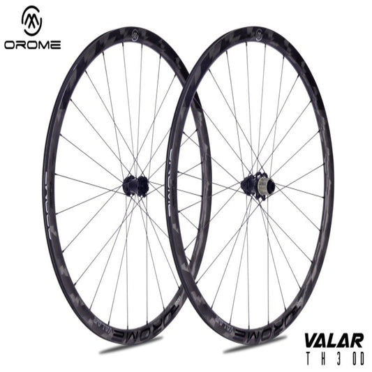 Two bicycle wheels with 'Orome' branding on a white background